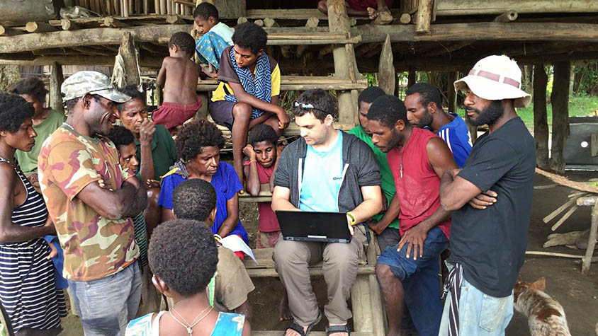 Ohad Nitzan of MyHeritage gathering genealogical information from local families in Papua, New Guinea. PHOTO: Golan Levi